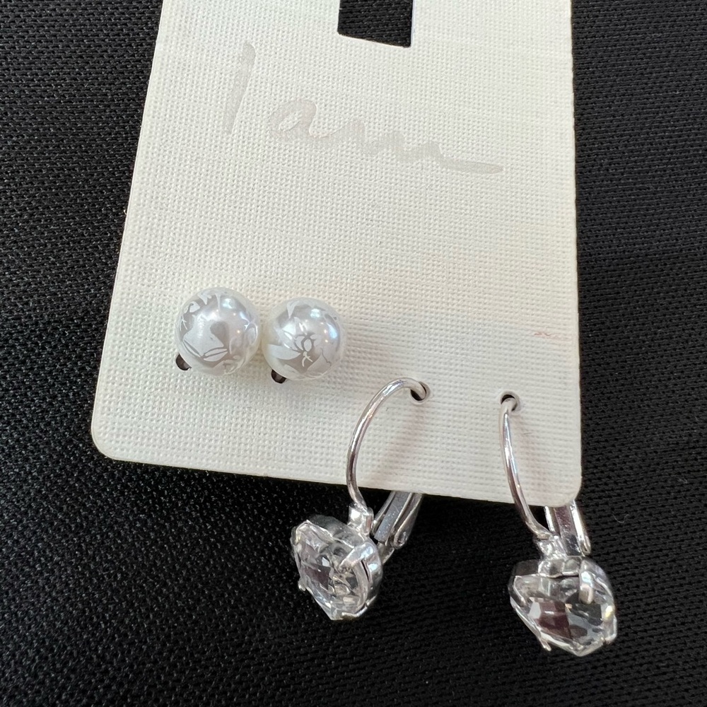 Two pairs of costume earrings. faux pearls and heart shaped tear drops